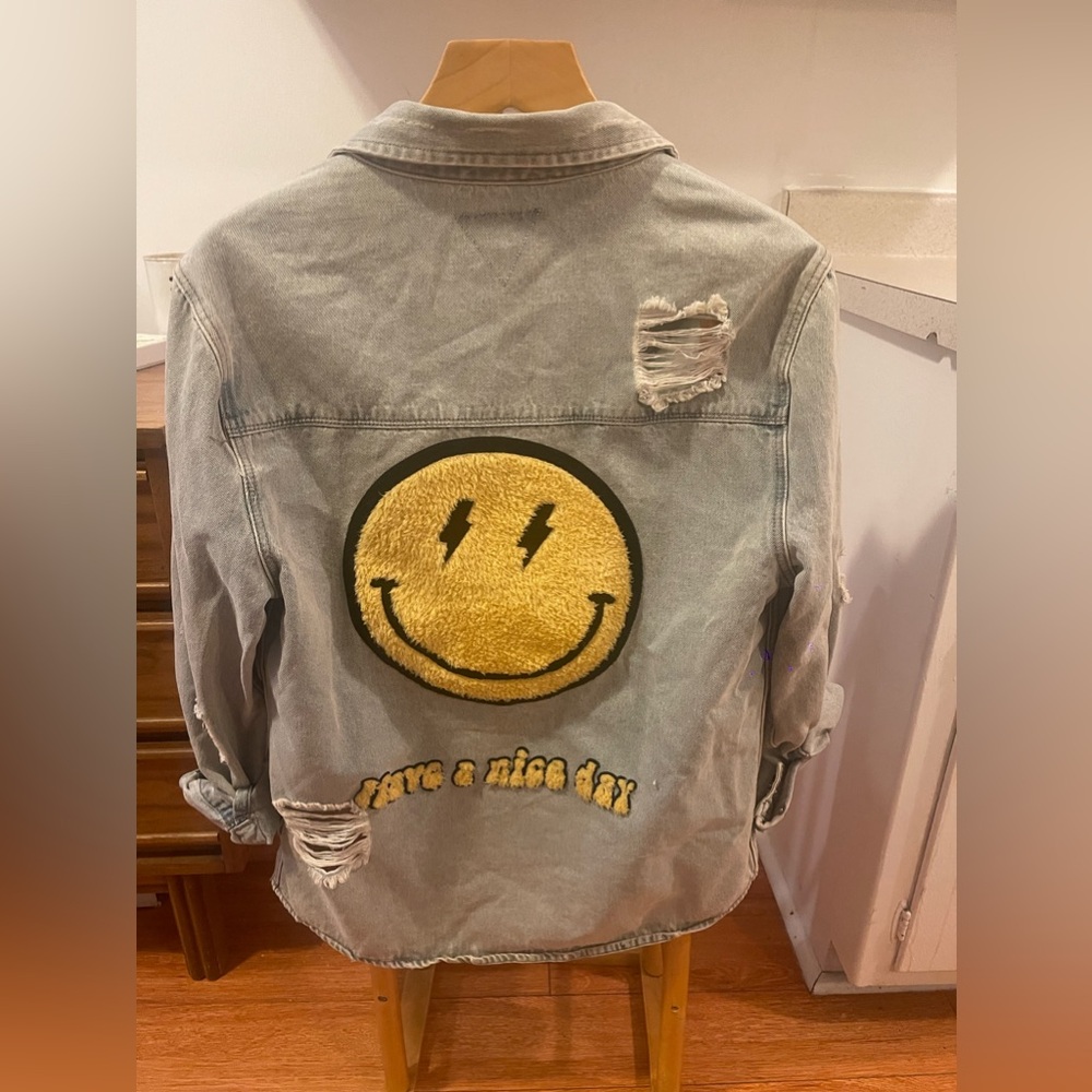 Distressed Light-Wash Denim Jacket with Smiley Face Embroidery